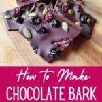 Closeup of chocolate bark with text how to make chocolate bark with dried fruit.