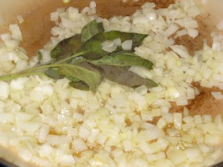 Sauteeing onions and sage in an enameled cast iron pan.