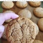 Freshly baked molasses cookie with a tray of more in the background