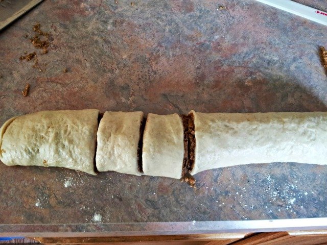 Cut the dough in half, then in half again and in half a third time to create eight equal sections