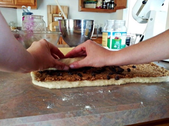 Carefully roll up the dough, tucking in the ends