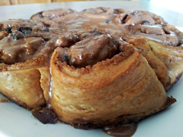 Cinnamon rolls covered in icing and ready to eat