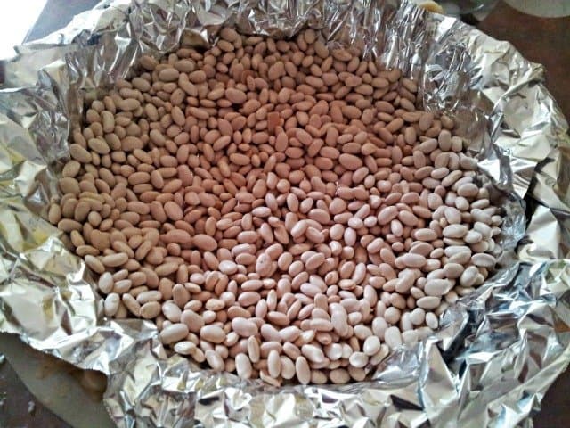Place rice, beans, or pie weights over foil in your crust