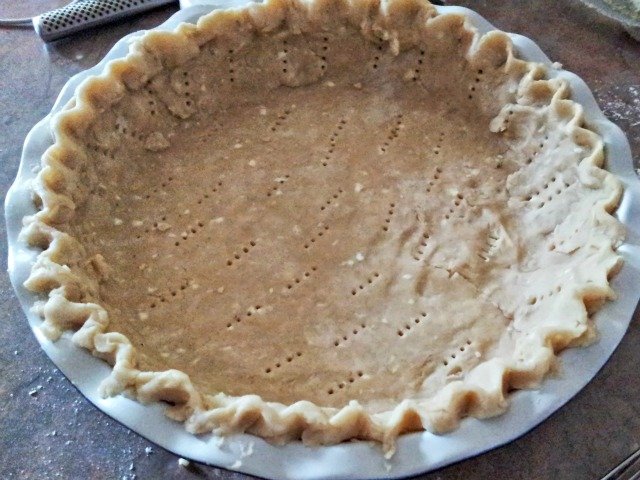 Prick the pie crust with a fork before baking