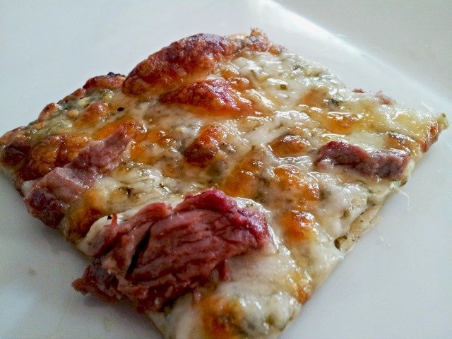 Slice of chimichurri pizza