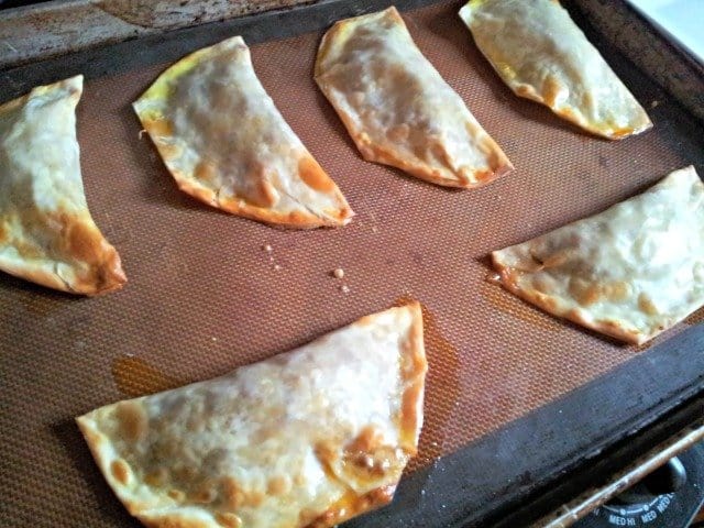 Baked empanadas are brown and crispy when done