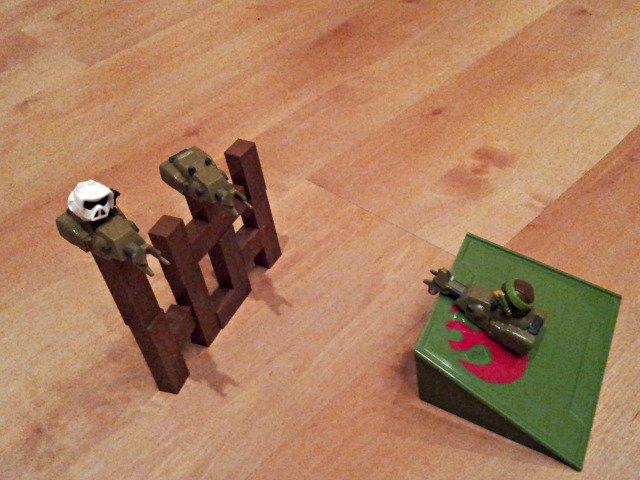 Pull the car back and let it destroy the piggies in Angry Birds