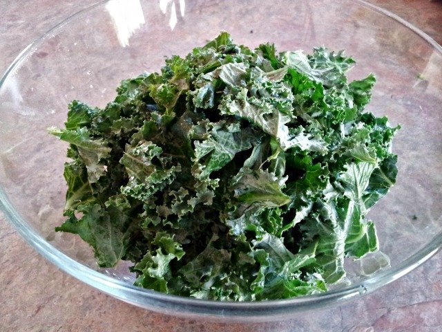 Kale in a bowl ready to dress for kale salad