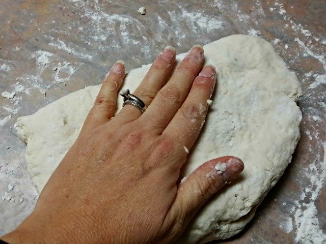 Gently kneading biscuit dough