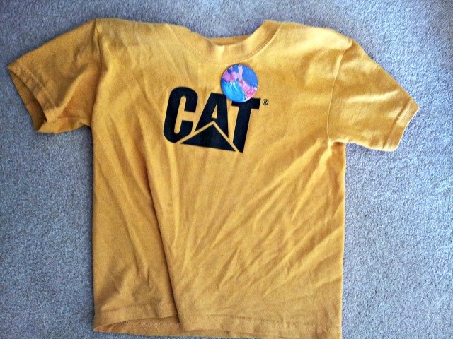 Clothing with sticker going into the laundry