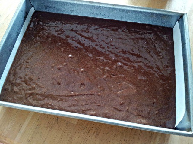 Spread brownie batter to the edges of the pan before baking