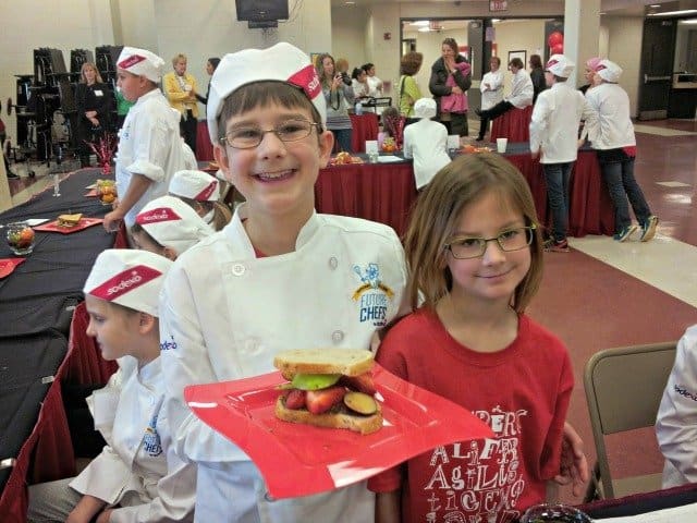 Proud future chef showing off his sweet protein sandwich