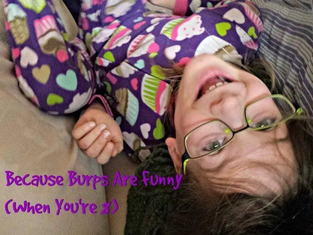 Girl in purple pajamas upside down on a white couch with text because burps are funny when you're 8.