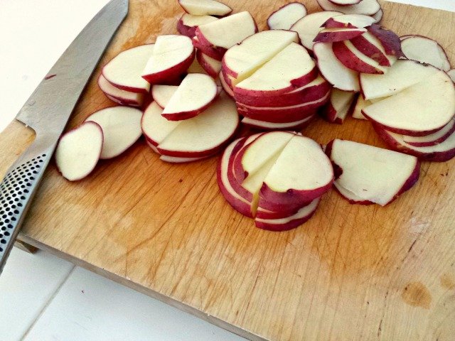 Potatoes sliced for Herbed French Potato Salad