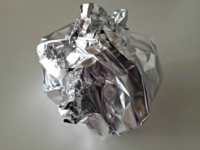 Foil with garlic inside ready to roast