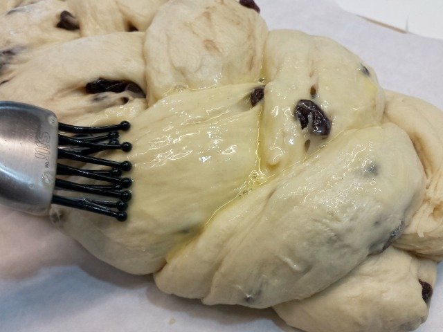 Brush your egg wash over your risen challah braid
