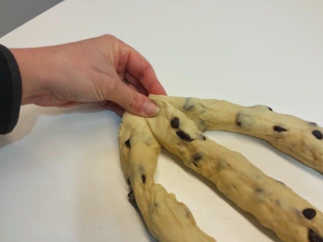Press the ends of your dough ropes together to start the braiding for Challah