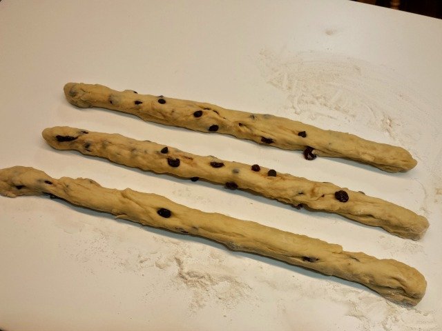 Three ropes are ready to be breaided for challah