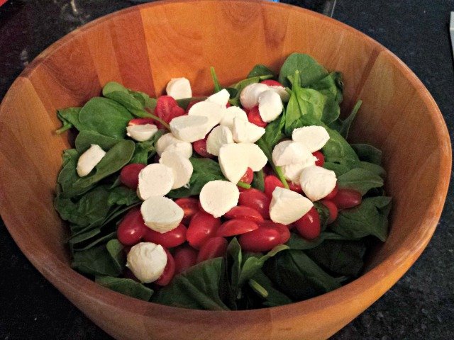 Add ciliegnini and grape tomatoes to your spinach