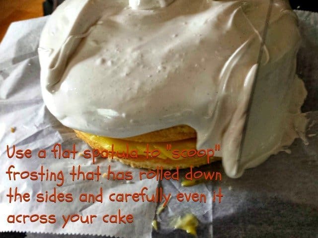 Use an offset spatula to pull frosting around the edges that has dripped from the top