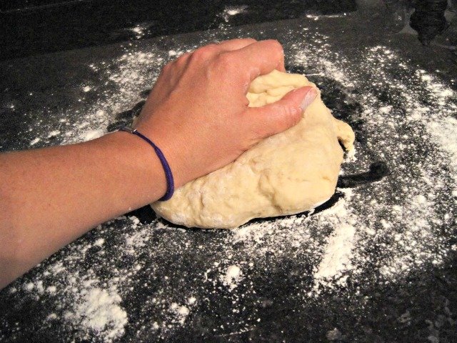 Kneading cinnamon roll dough