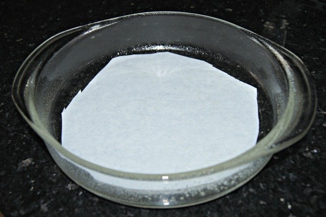 Use parchment paper circles to keep cake from sticking to pans