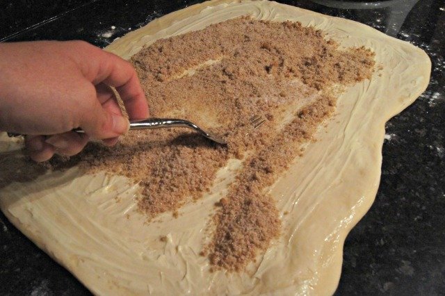 Spread cinnamon sugar over dough rectangle