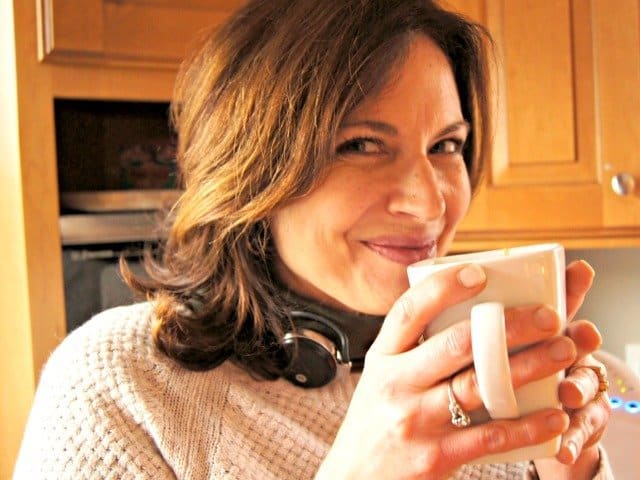 SMiling with a cup of coffee