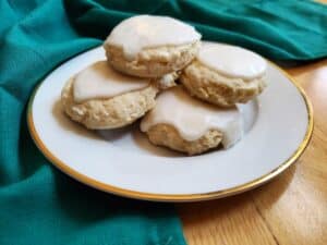Plate with lemon glazed cookies stacked on it.