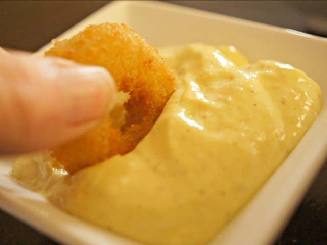 Onion ring dipped in mayo