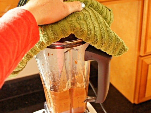 Use towel to hold lid on blender