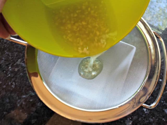 Strain garlic from garlic citrus sauce