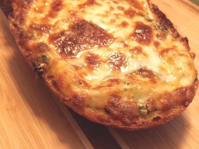 Closeup of cheesy garlic bread