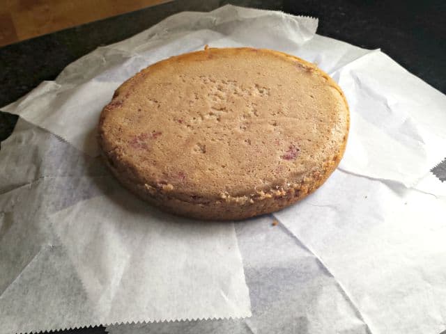 Prep homemade strawberry cake for frosting