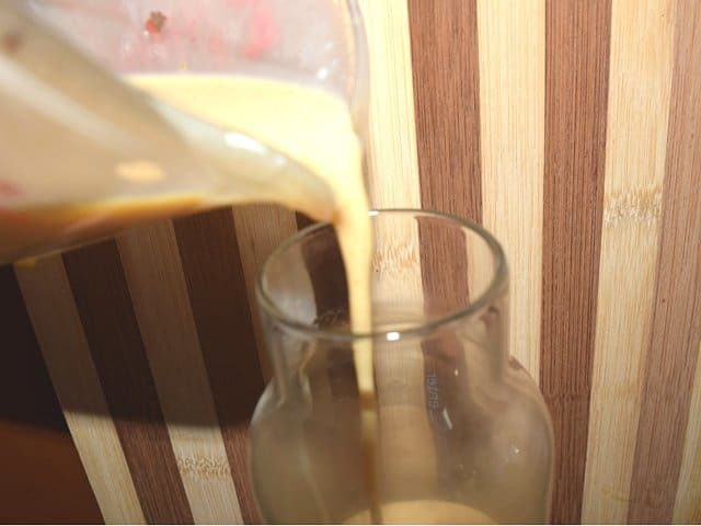 Use a liquid measuring cup to pour into a container