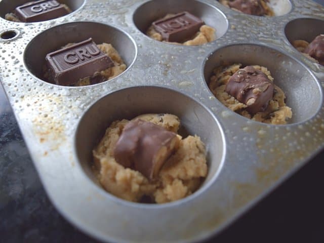 Add candy bars to first cookie scoop