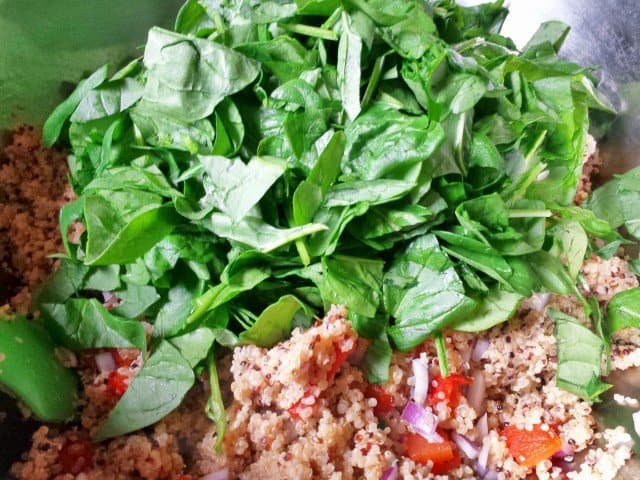 Add chopped spinach to quinoa and veggies