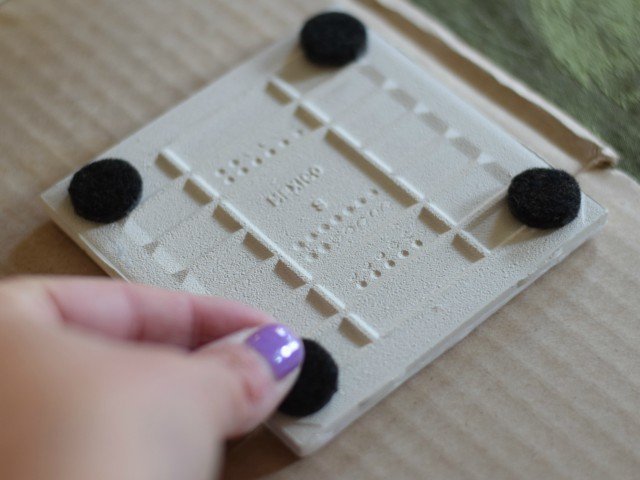 Apply felt sliders to bottom of finished photo coasters