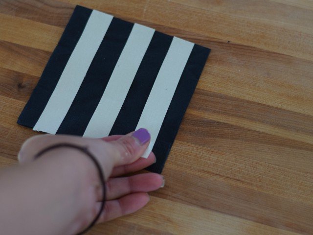 Apply washi tape in even strips across napkin