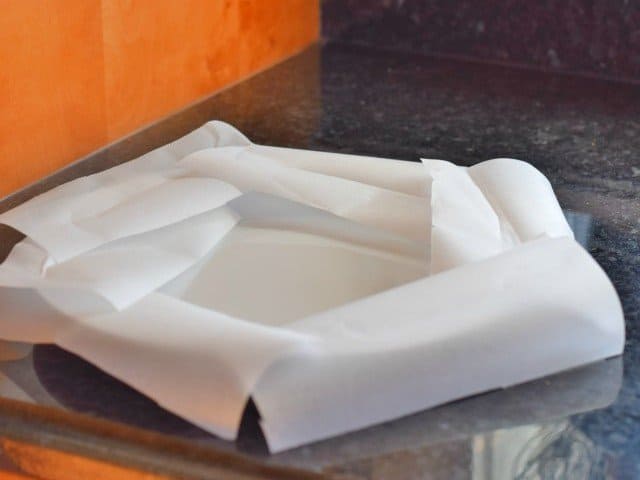 Line your cake plate with parchment paper strips to keep it clean while decorating your cake