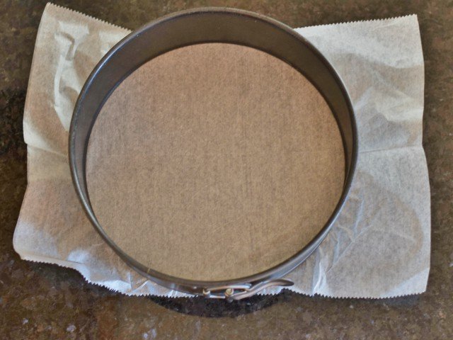 Line your springform pan with parchment paper
