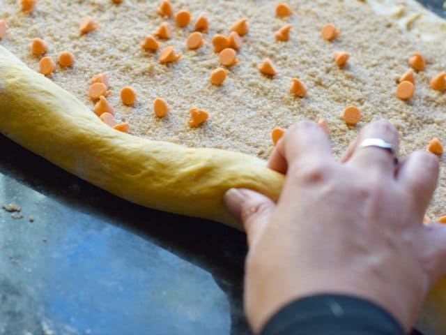 Roll the cinnamon roll along the long end