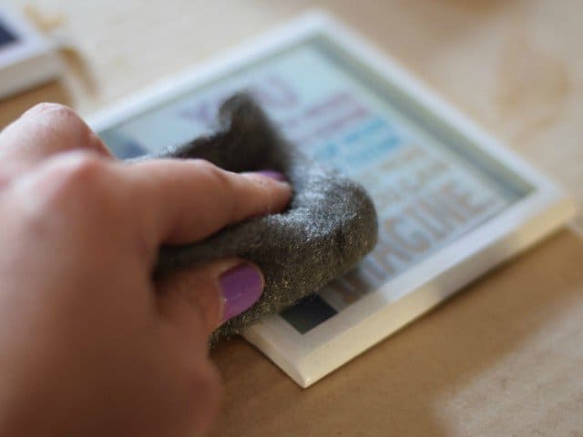 Use supefine steel wool to carefully sand between each Modge Podge layer