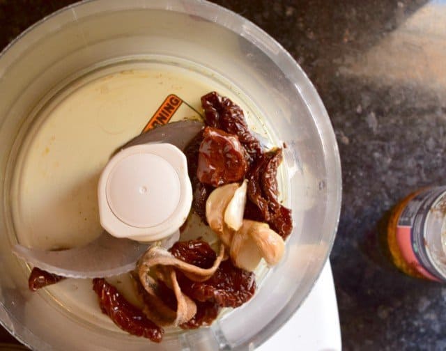 Add ingredients for sundried tomato pizza dipping sauce to food processor