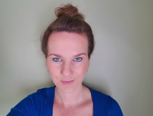 Create a high bun for a slimming hairstyles idea