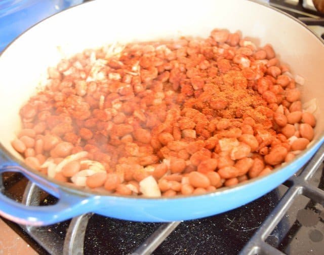 Add spices to refried beans