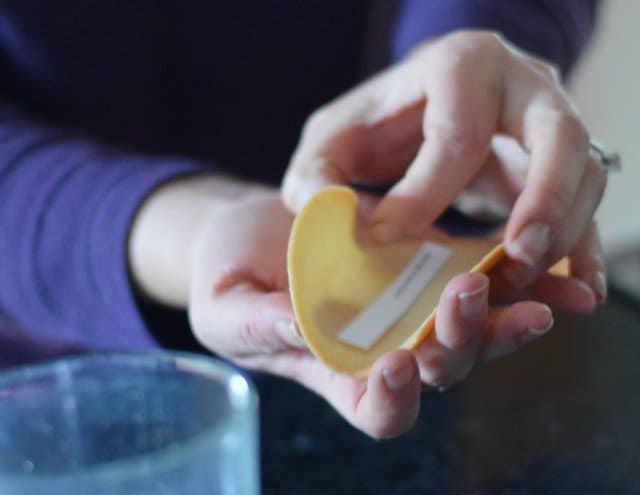 Add the fortune to your homemade fortune cookie and quickly bring the edges together