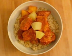 Delicious dinner of baked sweet and sour chicken