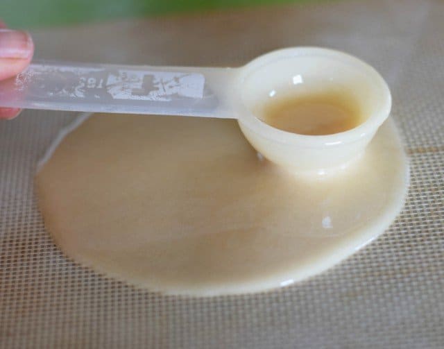 Gently use the back of a measuring spoon to spread into a 4 inch circle
