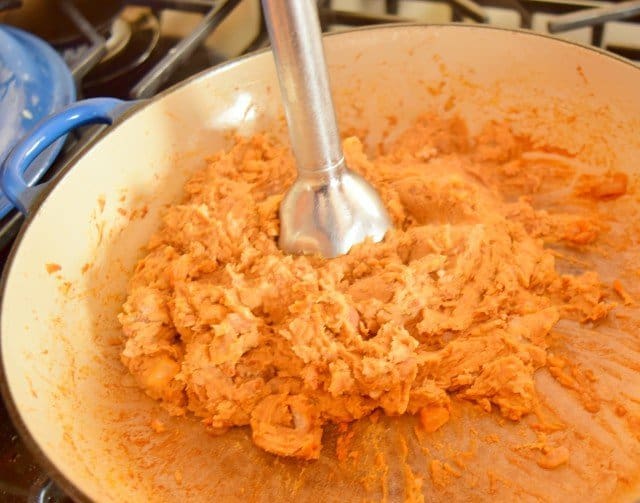 Puree the refried beans once they have simmered and cooked